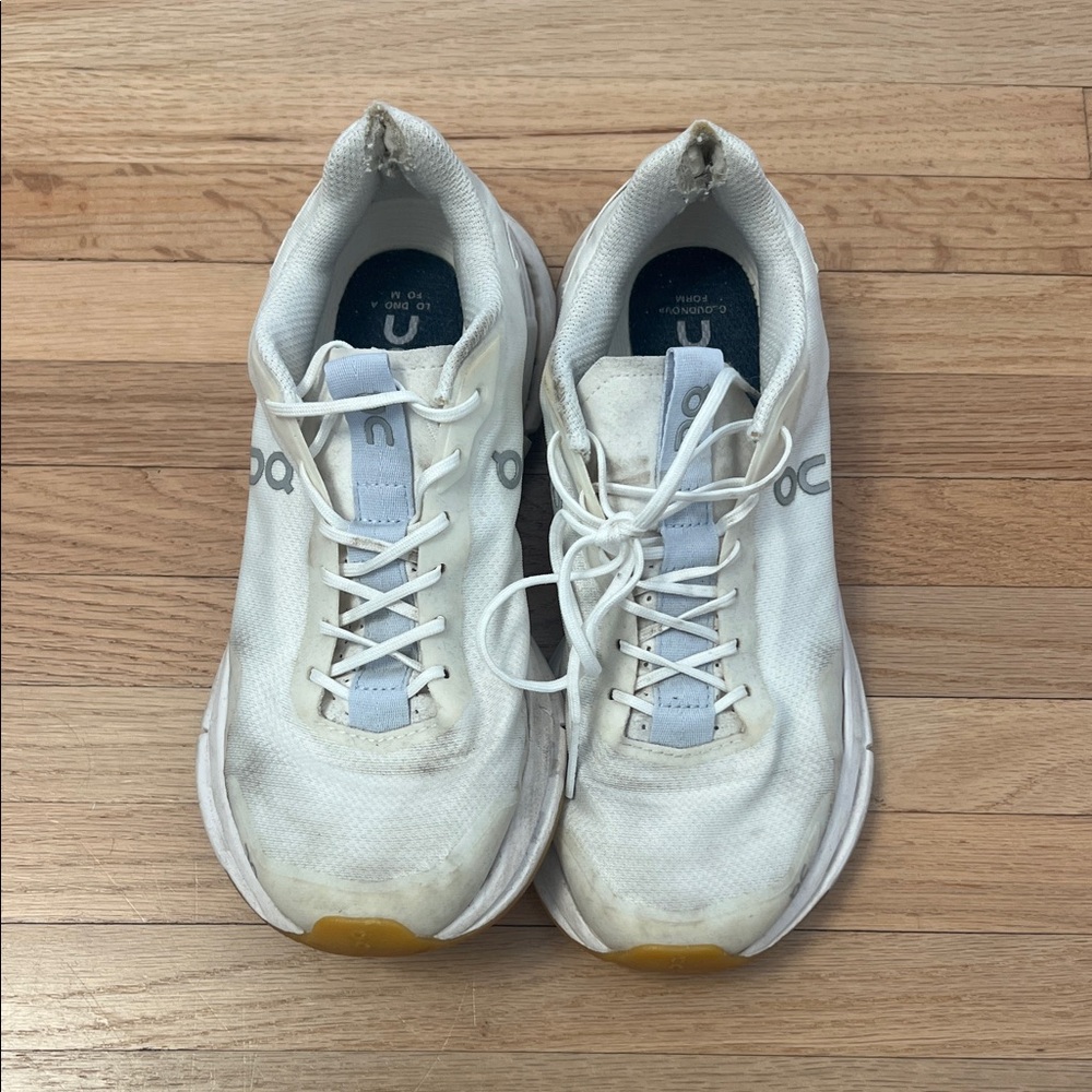 On Running White and Light Blue Athletic Shoes